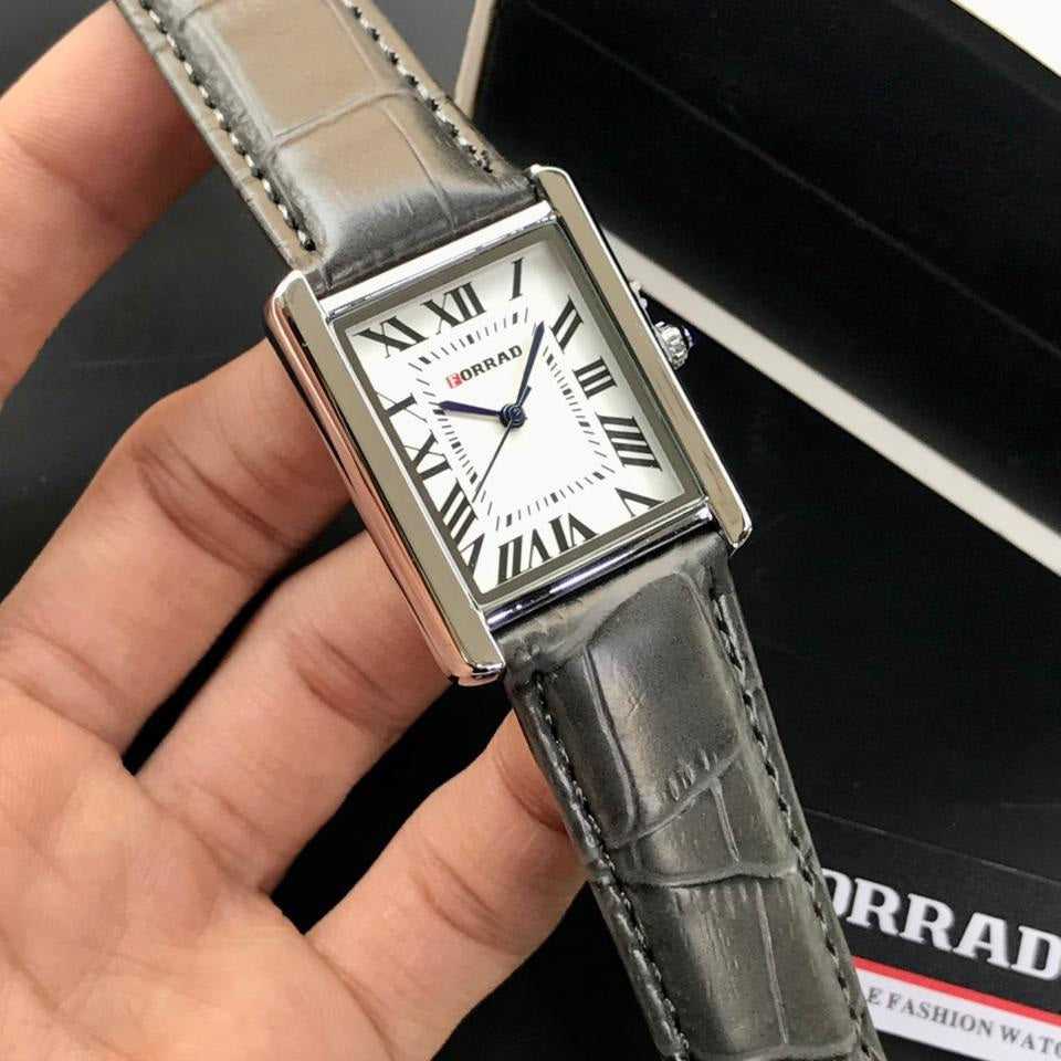 Men Watch with gray strap held by a hand, brand name visible 